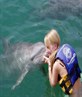 Me kissing a dolphin in Mexico