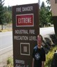 Smokin next to fire danger sign =)