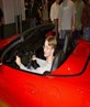 Eric in a red corvette