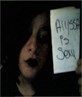 me again with a sign that says alyssa is sexy