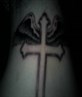 my tattoo on ma bk of neck.cross wid angl wng