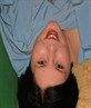 Me layin on the sofa looking back at my sis.