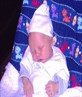 kieran 2 wks old asleep in hat grandad brought hi