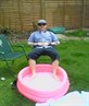 Me enjoyin the sun with a pink paddlin pool