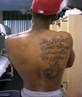 no shirt tattoos and some war wounds