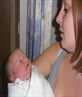Sister holding my son jus after he was born
